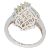 Elegant Marquise Green Peridot Sterling Silver Ring showcasing intricate design and shimmering gemstones.